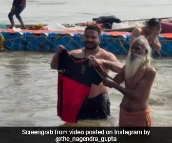 Watch: RCB Fan Dips Jersey In Water, Performs Special Ritual At Maha Kumbh