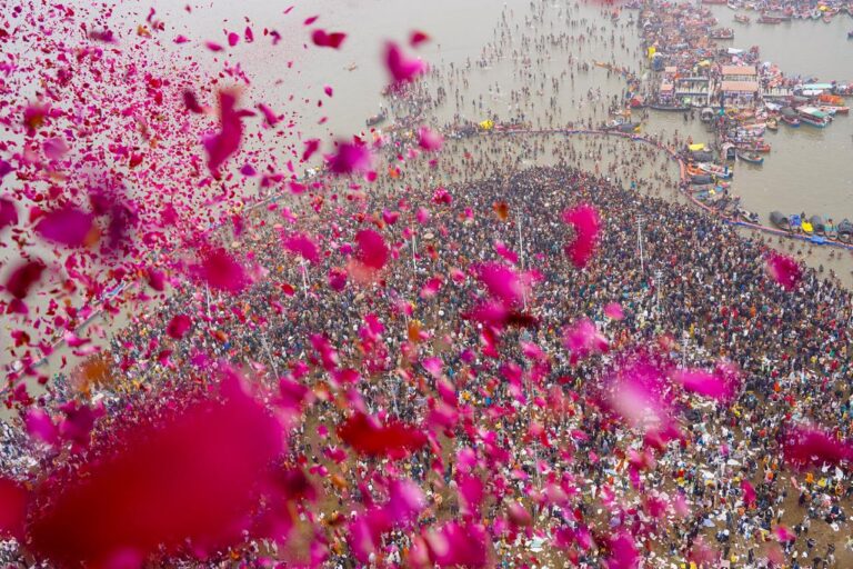 Rose Petals Showered On Devotees From Helicopters At Maha Kumbh